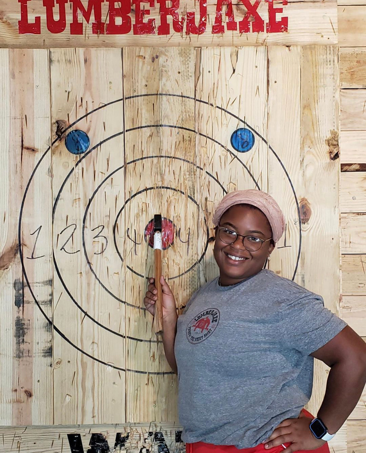 girl near axe board